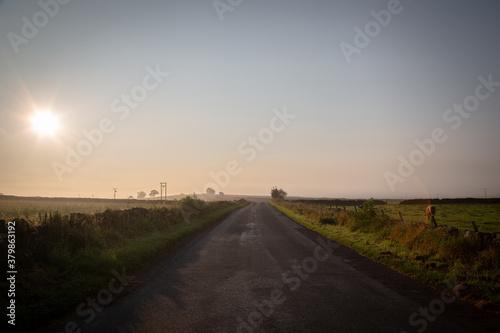 Hazy early morning sunrise on the back road to Bakewell
