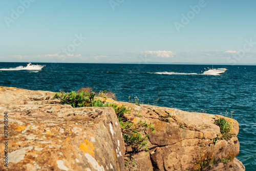 Two motorboats racing in the ocean photo