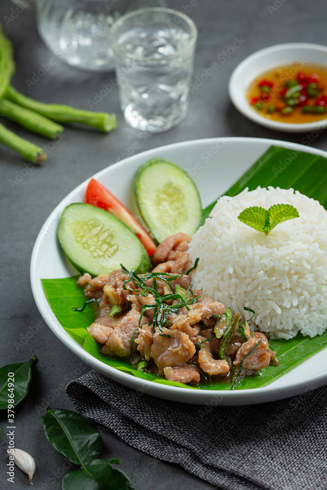 thai food ;Stir-fried pork with kaffir lime leaves serve with rice thai food ;Stir-fried pork with kaffir lime leaves serve with rice