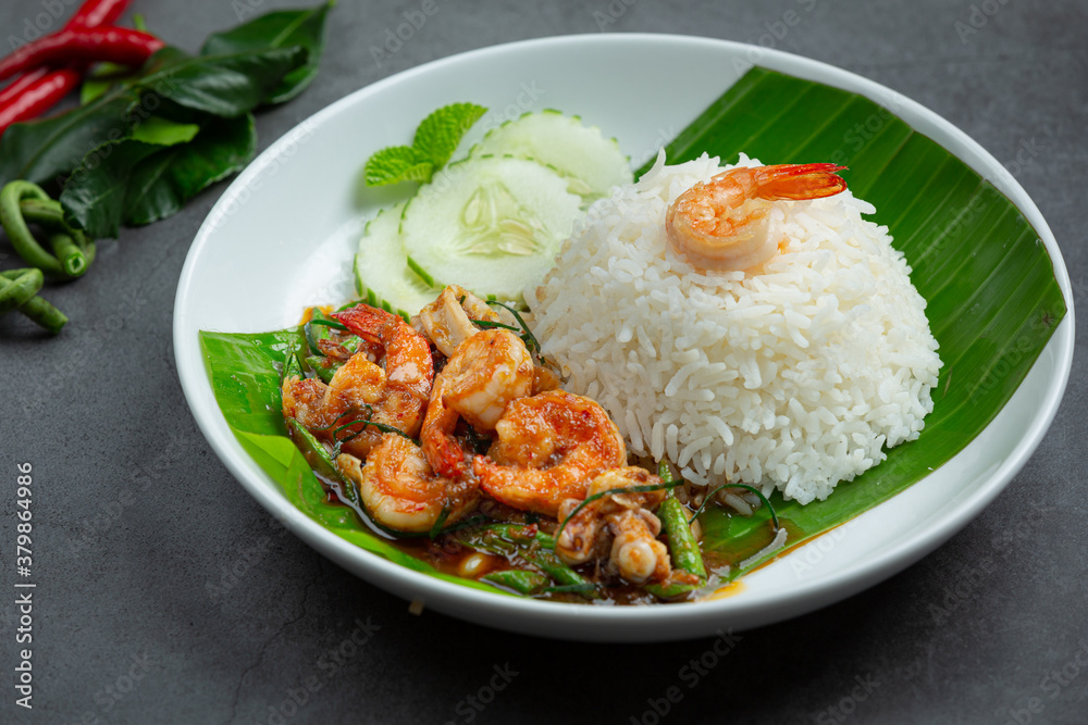 Thai food; Shrimp and squid fried cooked with long beans and rice. Thai food; Shrimp and squid fried cooked with long beans and rice.
