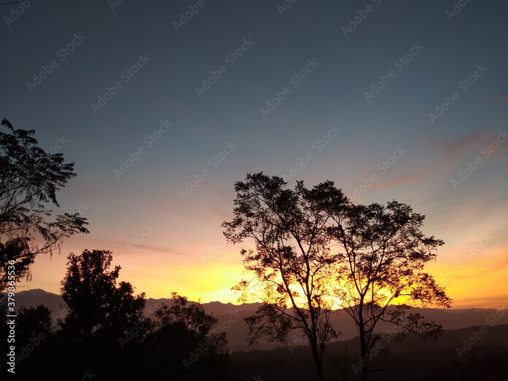 SUNSET OVER THE MOUTAIN