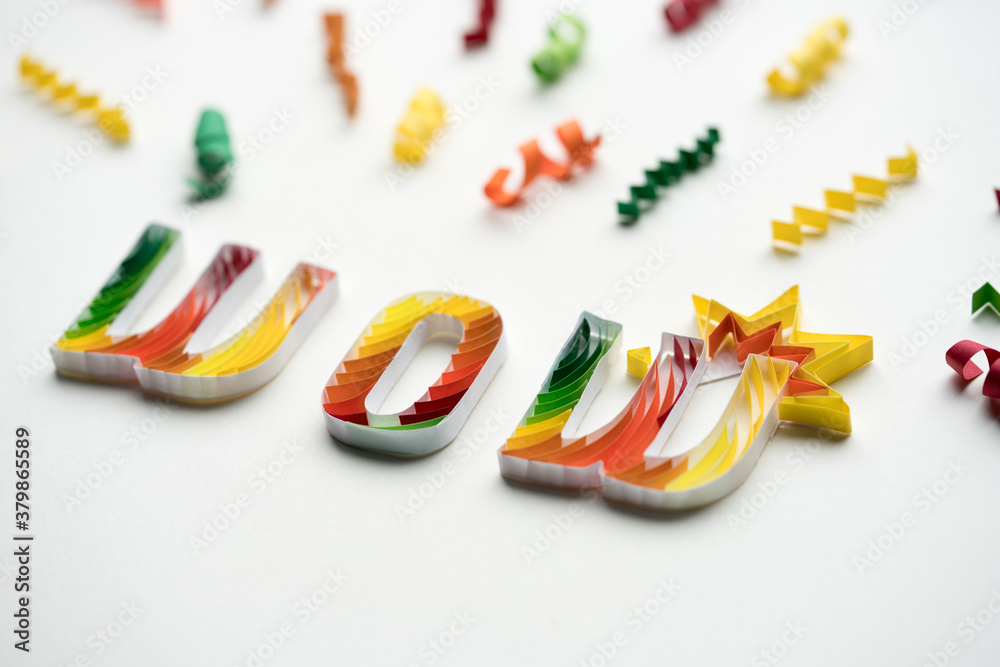 Wow word written on white with confetti Wow word written on white with confetti