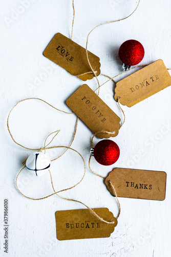 xmas tags with words symbolising actions other than gift giving