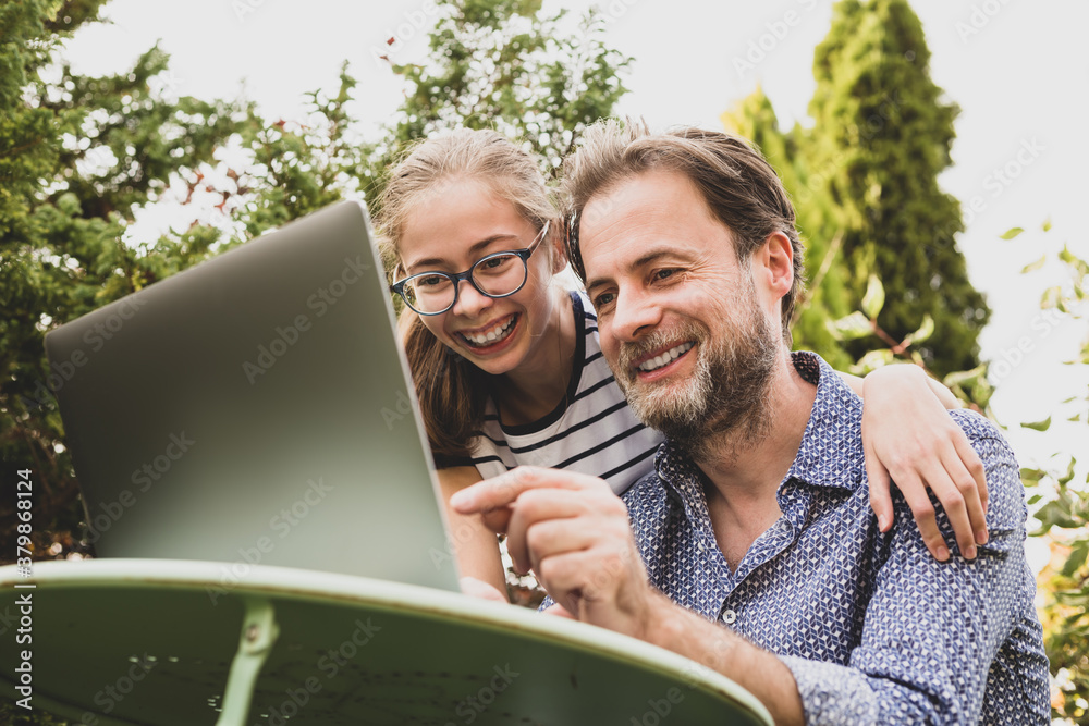 Caucasian father and daughter having video chat on laptop computer Caucasian father and daughter having video chat on laptop computer