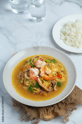 Stir-fried with mixed seafood, served with steamed rice, Thai food.