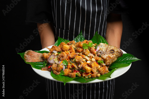 Spicy Fried Tubtim Fish Salad, Spicy, Thai Food. photo