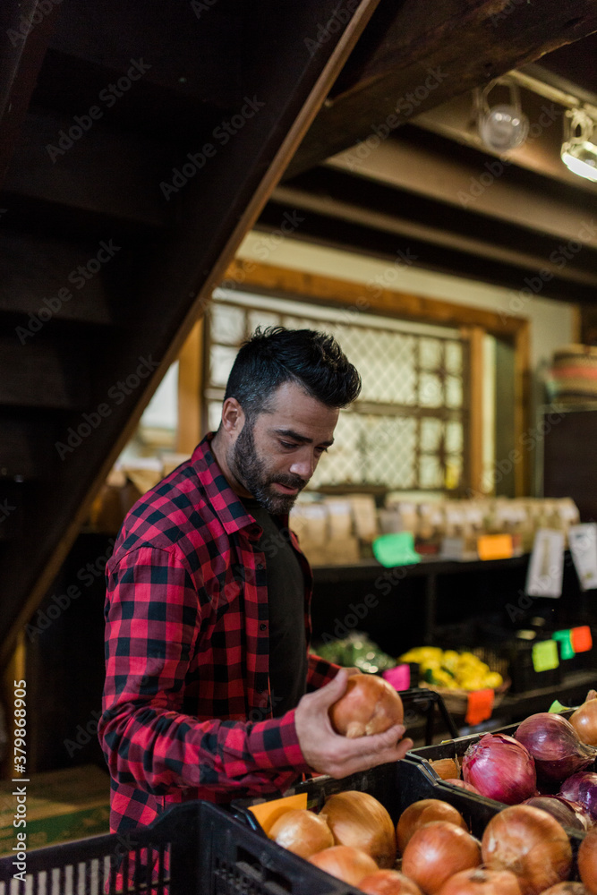 A middle aged man doing some shopping at farmers market A middle aged man doing some shopping at farmers market