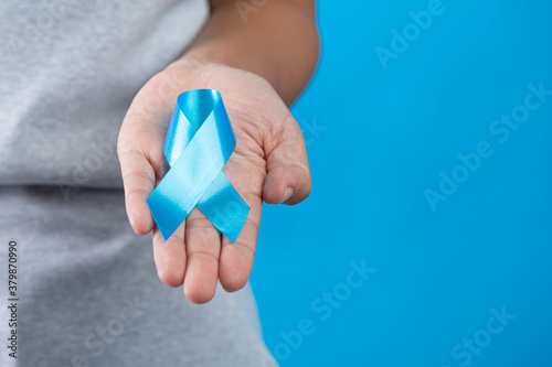 World diabetes day; hand holding blue ribbon