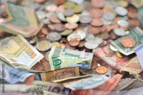 Pile of coins and bank notes