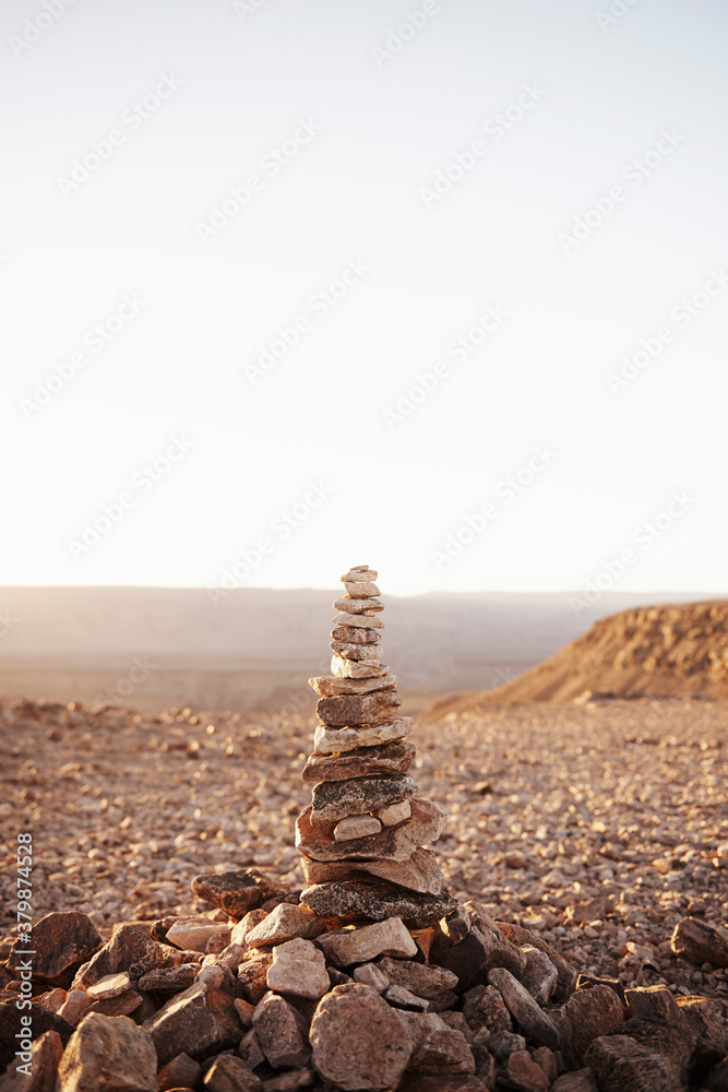 Stacked pile of rocks along a hiking trail Stacked pile of rocks along a hiking trail