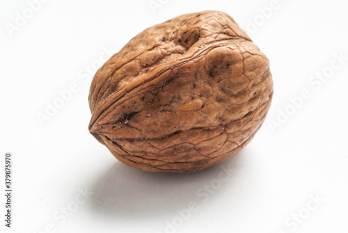 Walnut in shell isolated on white background