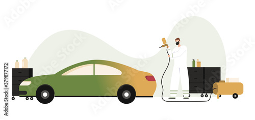 Auto mechanic working with paint spraying gun, airbrush painting car
