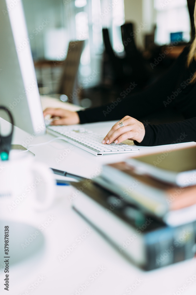 Woman Sitting At Office Desk, Navigating With Mouse and Keyboard Woman Sitting At Office Desk, Navigating With Mouse and Keyboard
