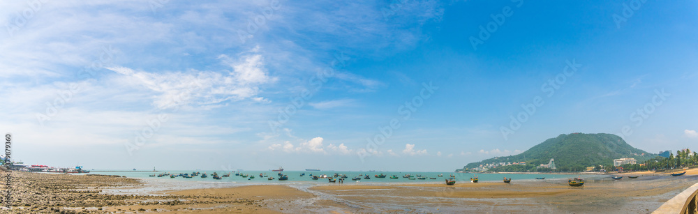 Colorful local fishing boats anchored by the coastline at Vung Tau, Vietnam. Selective focus