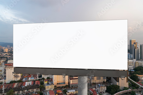 Canvas Print Blank white road billboard with Kuala Lumpur cityscape background at sunset