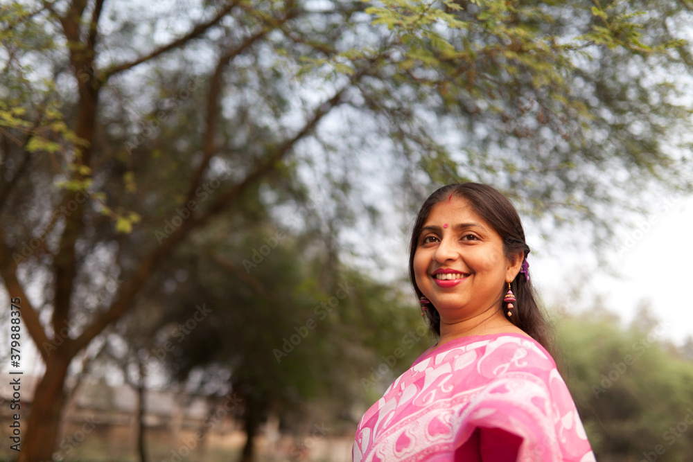 Cheerful Indian woman with traditional dress at outdoor Cheerful Indian woman with traditional dress at outdoor