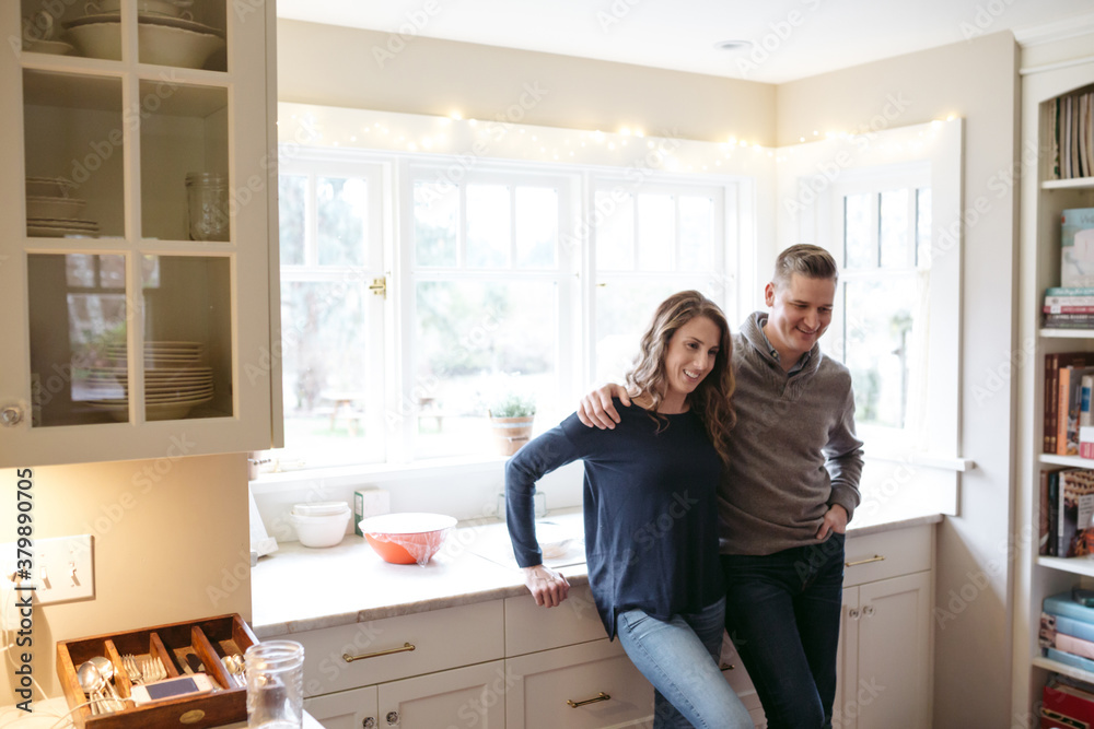 Content couple in kitchen together Content couple in kitchen together