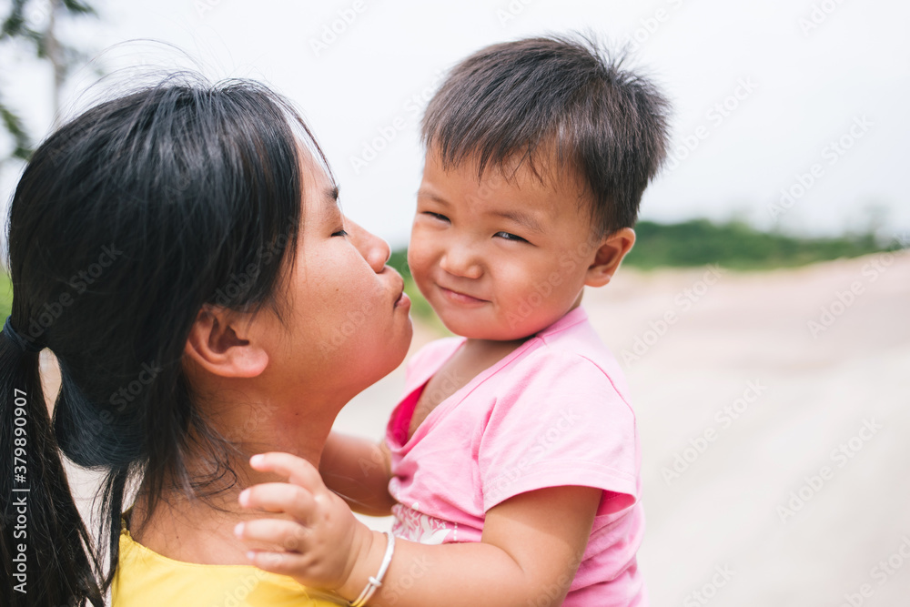 Cute little girl playing with mother on the road Cute little girl playing with mother on the road