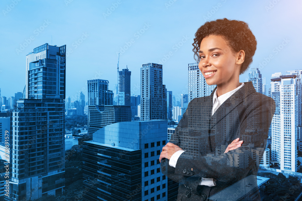 Smiling black African American business woman in suit in crossed arms pose. Bangkok cityscape. The concept of woman in business. Investment fund. Double exposure. Smiling black African American business woman in suit in crossed arms pose. Bangkok cityscape. The concept of woman in business. Investment fund. Double exposure.