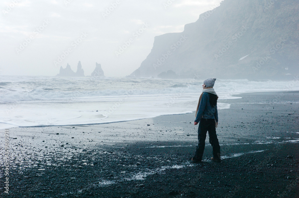 © Duet Postscriptum/Stocksy - Person on gravel sea shore in storm © Duet Postscriptum/Stocksy - Person on gravel sea shore in storm