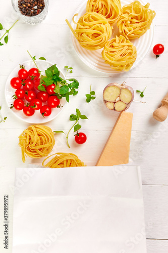 Healthy food in paper bag, Ingredients for cooking Italian pasta