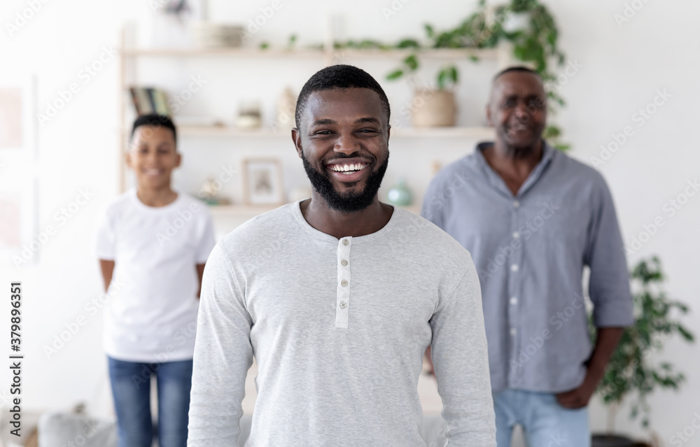Male Generations. Happy Black Man On Foreground Posing With His Son And Dad At Home Male Generations. Happy Black Man On Foreground Posing With His Son And Dad At Home