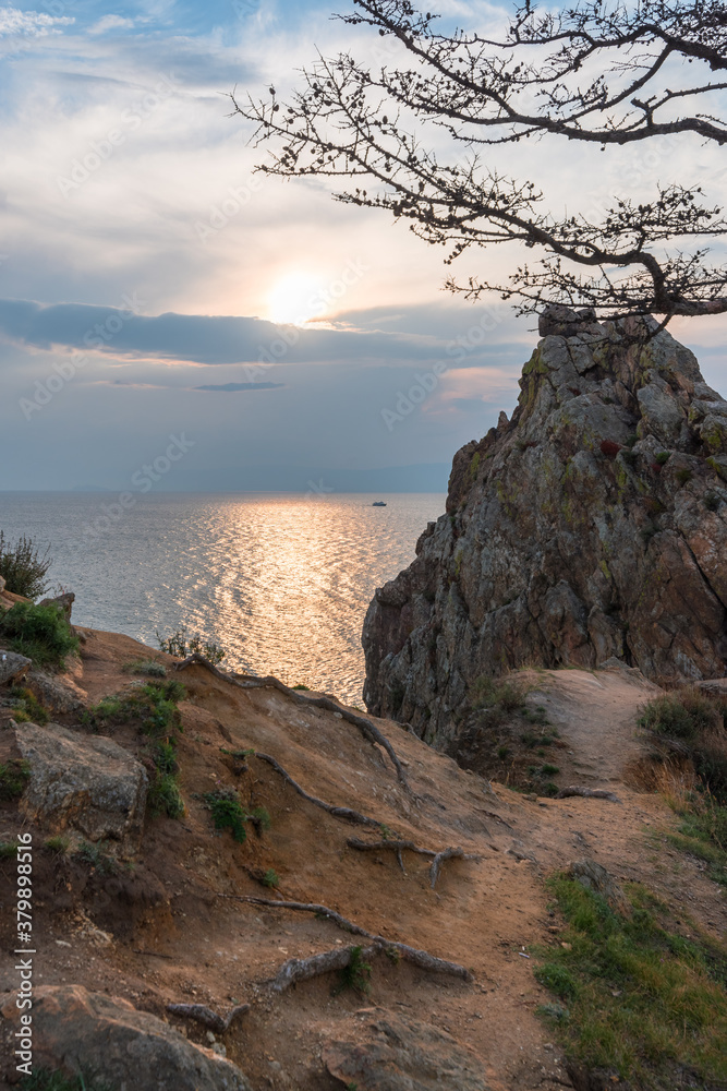 Lake Baikal in evening time. View of the sacred cape Burkhan and Shamanka rock.