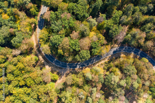 Aerial view of a winding road through the forest in the Taunus / Germany near Reckenroth