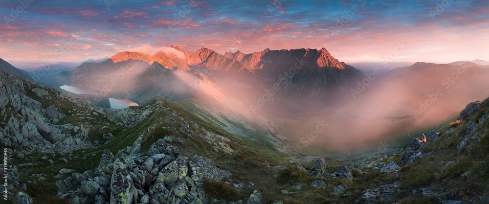 Fototapeta premium Scenic image of Fairytale mountains during sunset. The sunrise over a mountain in park High Tatras. Slovakia, Europe. Wonderful Autumn landscape. Picturesque view of nature Amazing natural Background