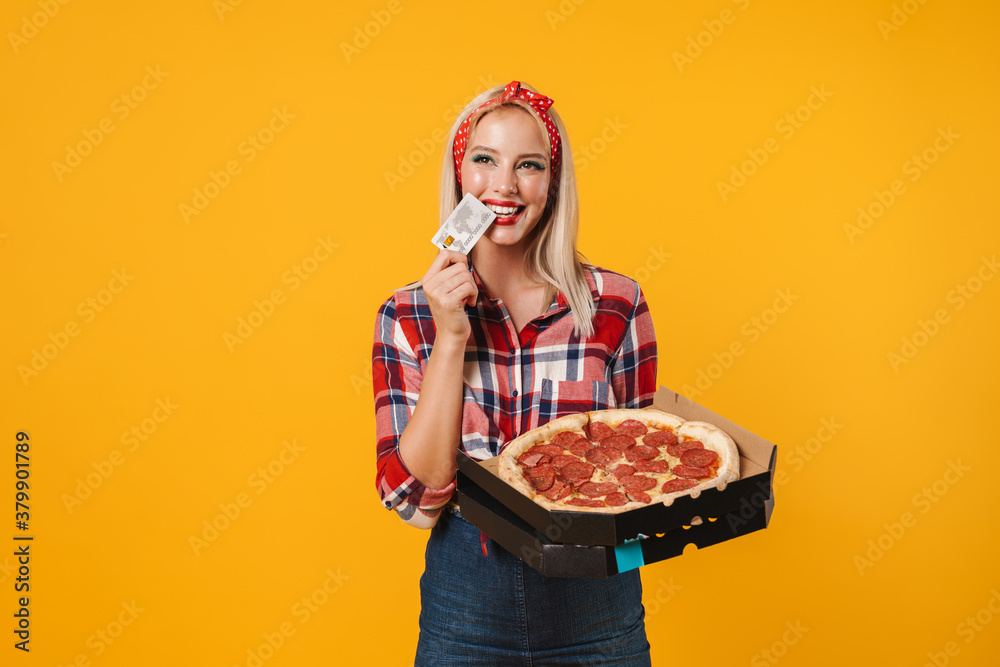 Image of happy charming pinup girl posing with credit card and pizza