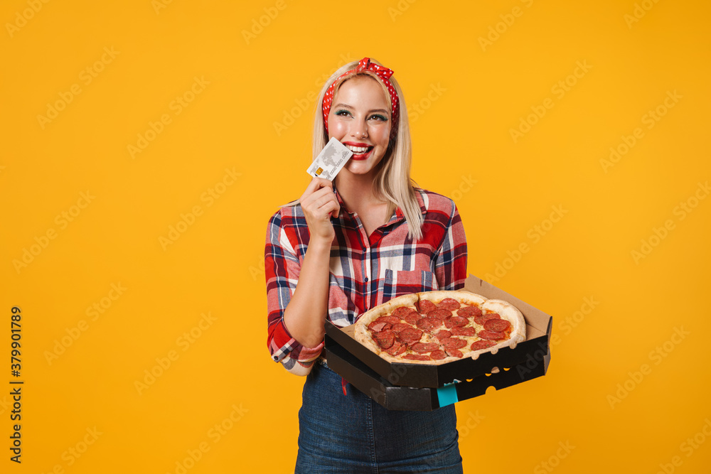 Image of happy charming pinup girl posing with credit card and pizza Image of happy charming pinup girl posing with credit card and pizza