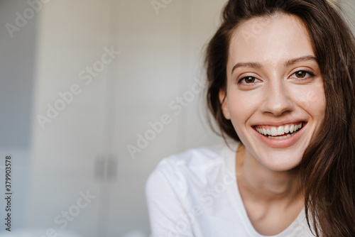 Close-up portrait of an attractive young woman smiling