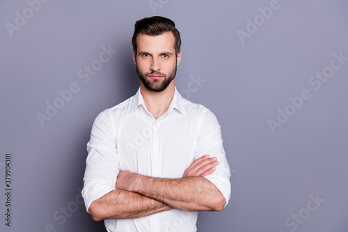 Portrait of his he nice attractive content brutal serious brunet guy model executive it professional sales manager folded arms isolated over gray pastel color background