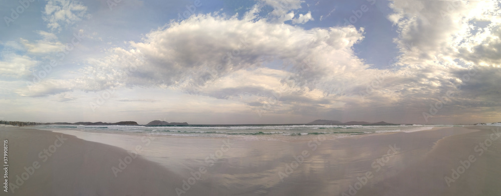 Panoramic view to the beach with stunning cloudy sky above it Panoramic view to the beach with stunning cloudy sky above it