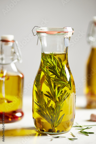 Glass bottle of infused olive oil. photo