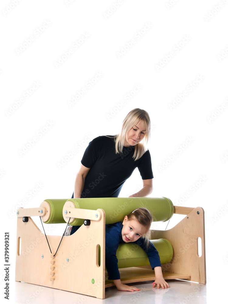 Little girl and her mother showing principles of training on compact ...