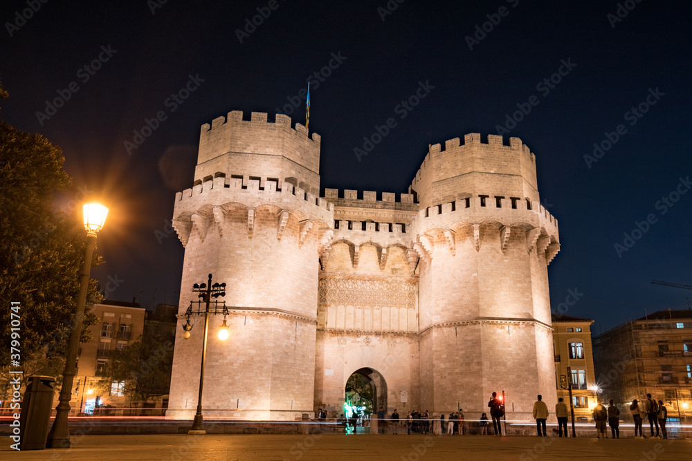 Tourists near Serranos towers at night Tourists near Serranos towers at night