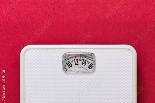 Scale On Red Background