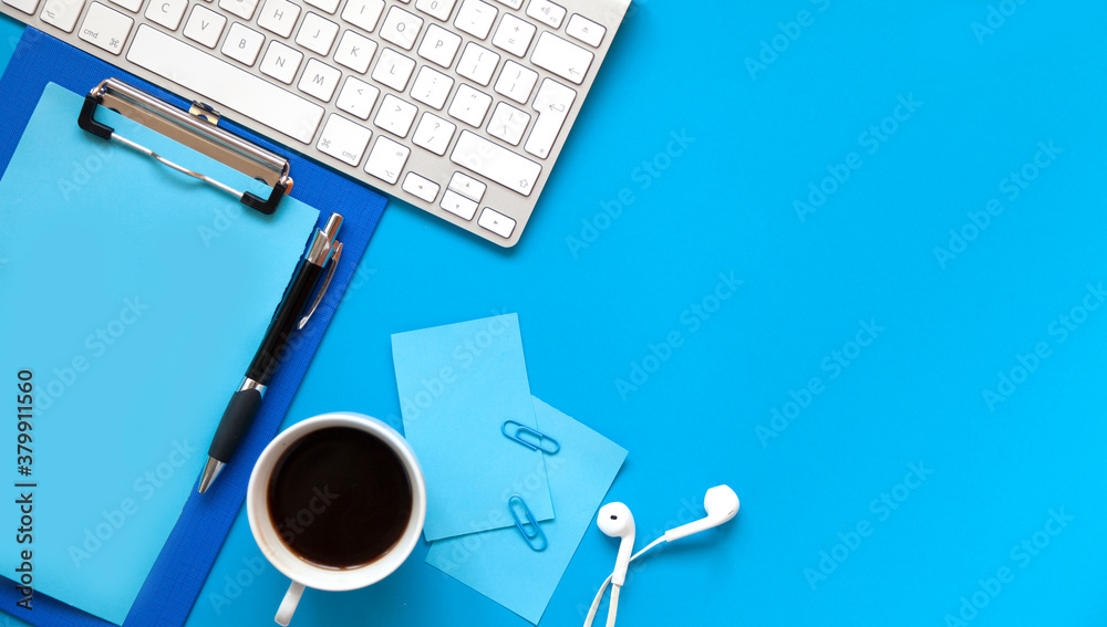 blue office desk background with smartphone with blank screen mockup, laptop computer, cup of coffee and supplies. Top view with copy space, flat lay. blue office desk background with smartphone with blank screen mockup, laptop computer, cup of coffee and supplies. Top view with copy space, flat lay.