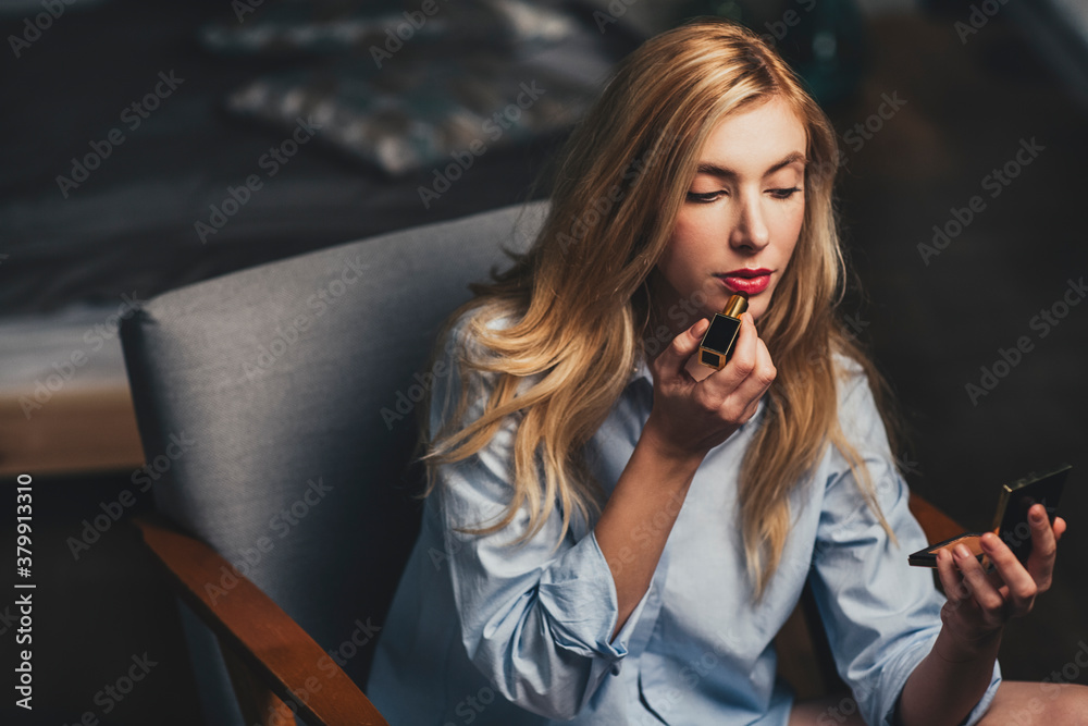 Woman Putting Lipstick On Woman Putting Lipstick On