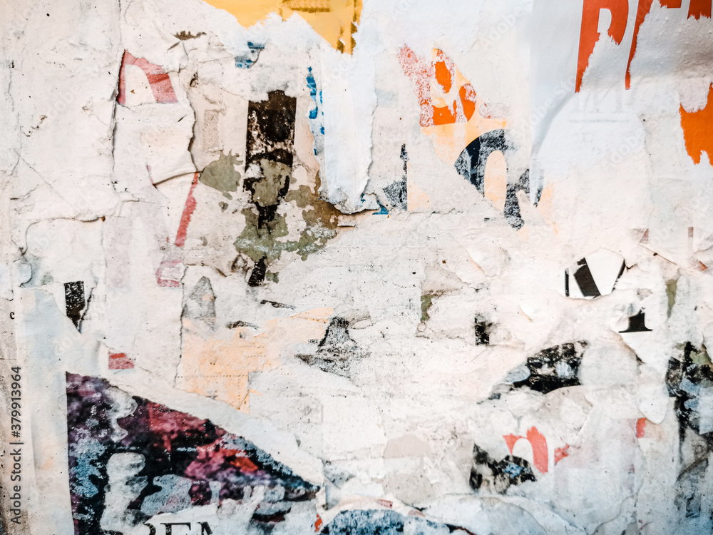 Fototapeta premium Vintage old posters stuck and torn on the wall in your grunge background