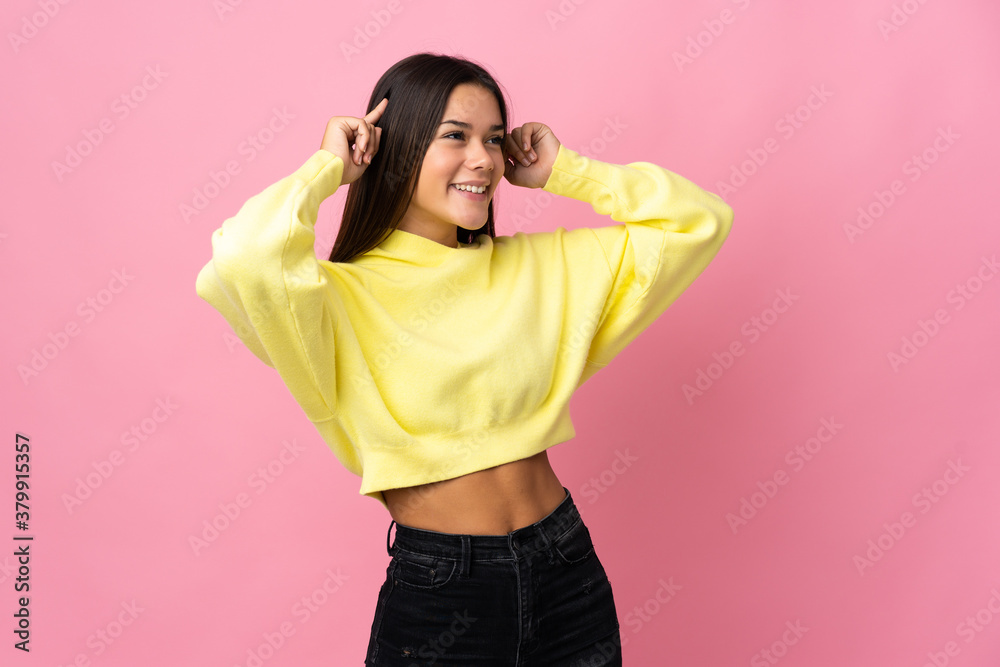 Teenager girl isolated on pink background having doubts and thinking Teenager girl isolated on pink background having doubts and thinking
