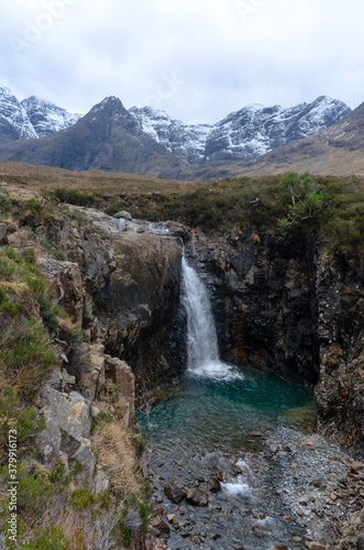 beautiful waterfalls Fairy Pools under the snowy mountains