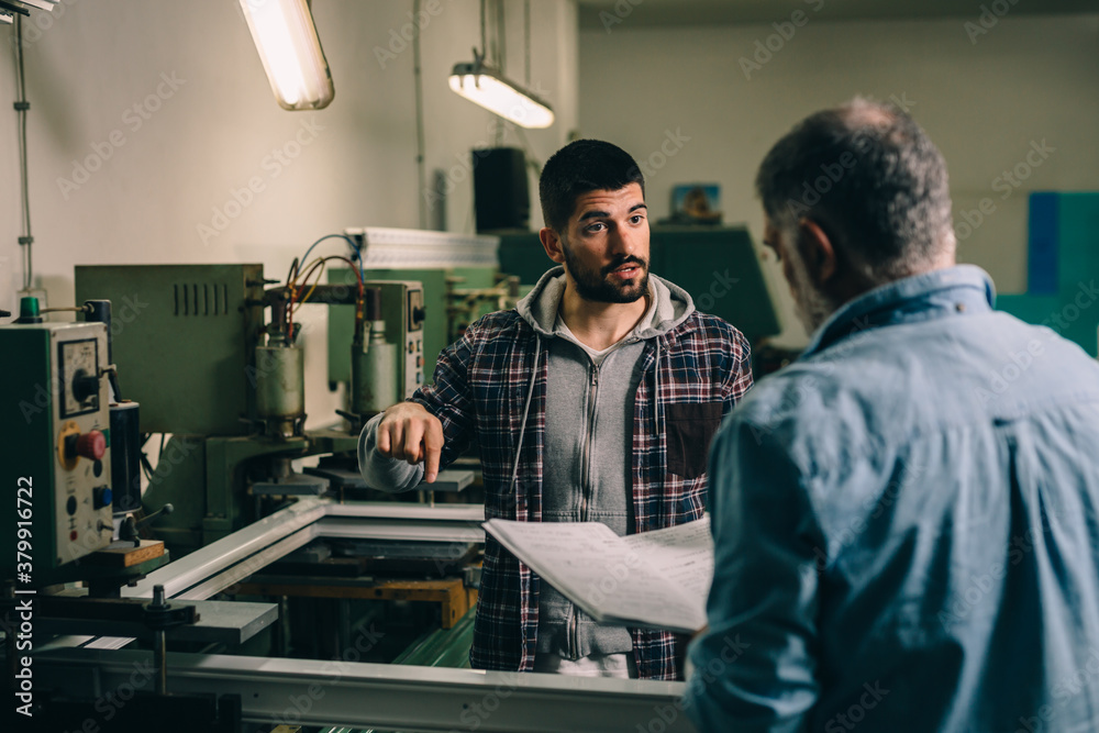 Aluminium and PVC industry workers making PVC or aluminium frames for windows and doors Aluminium and PVC industry workers making PVC or aluminium frames for windows and doors