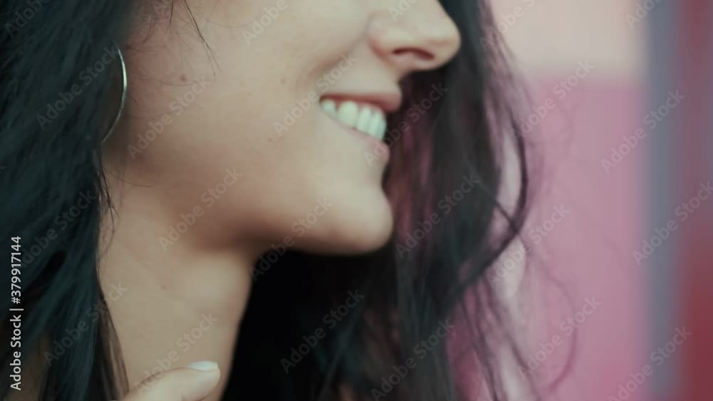 Woman face close-up. A girl with a snow-white smile