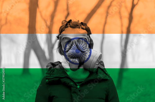Canvas Print Photo of woman wearing protective gas mask against the background of the India flag