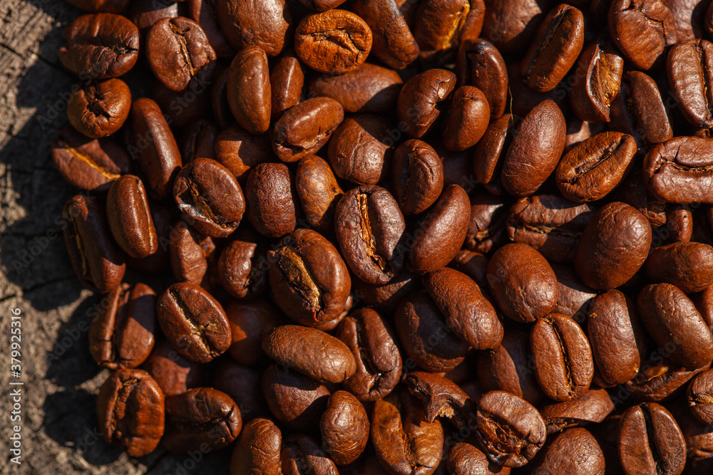 roasted Coffee beans on wood background roasted Coffee beans on wood background