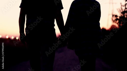 Senior couple walking and holding hands in the city, during sunset, 120fps
