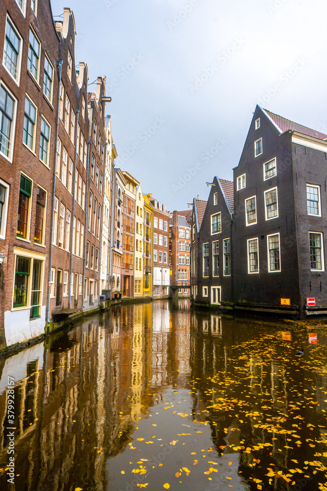 Beautiful building and canals near Red light and Damrak street  in Amsterdam , Netherlands
