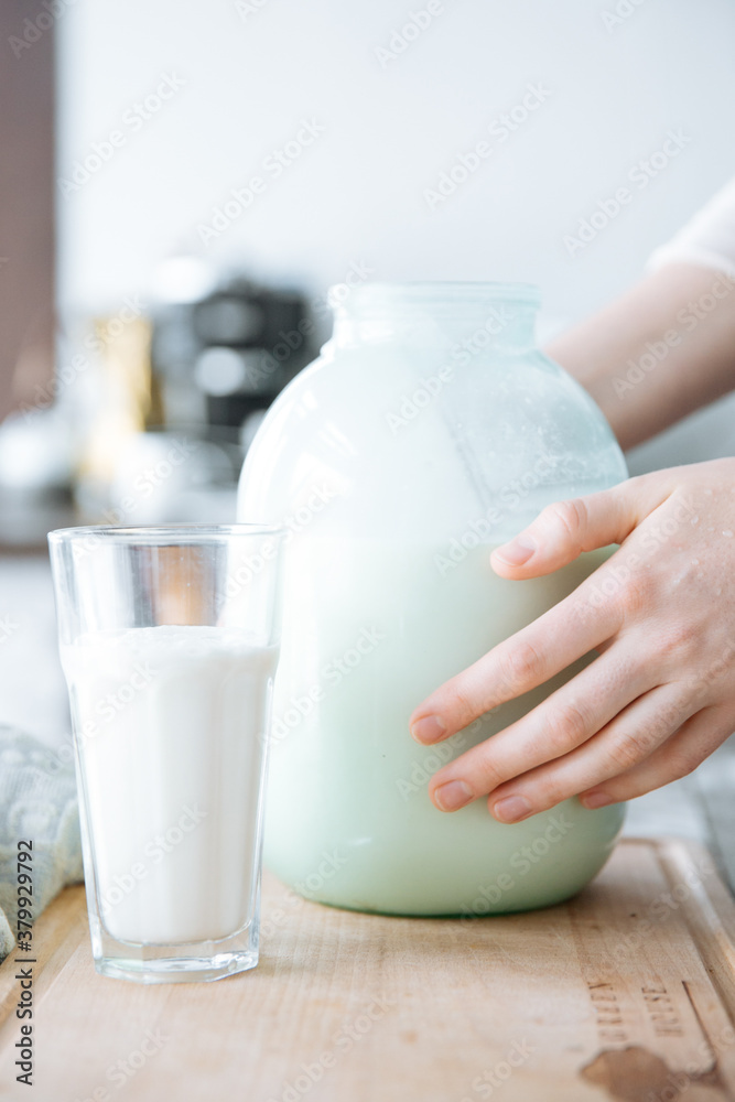 A glass and a jar of milk A glass and a jar of milk